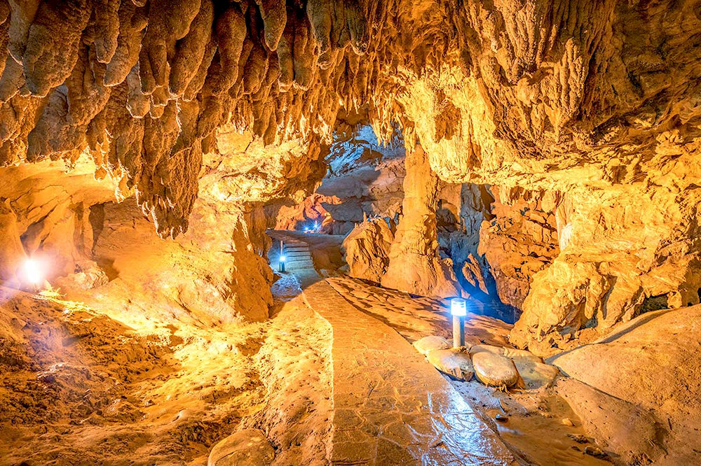 Dramatic limestone formations twist and curve like sculptural masterpieces shaped by millions of years